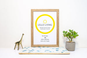 Solid Oak Frame, A4 oak frame with a plant, blue tile and a silver animal decoration