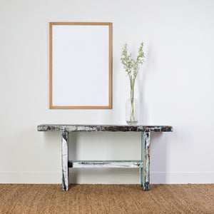 A2 oak frame, wall hanging frame with a bench underneath holding a glass vase with green oats